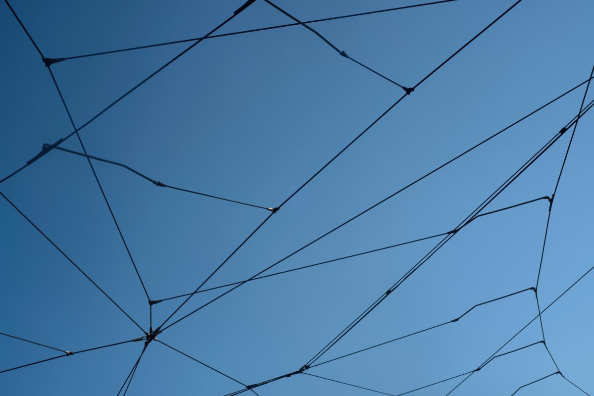Transport power lines against a blue sky